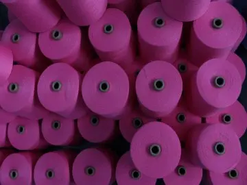 Colorful dyed yarn spools by J Korin